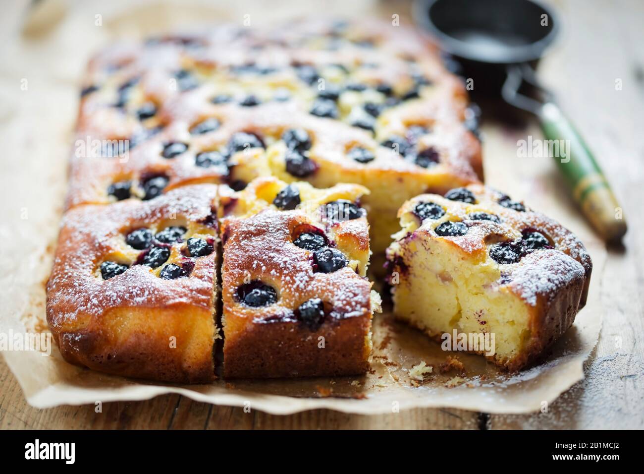 Lime juice, yoghurt, olive oil cake with blueberries Stock Photo