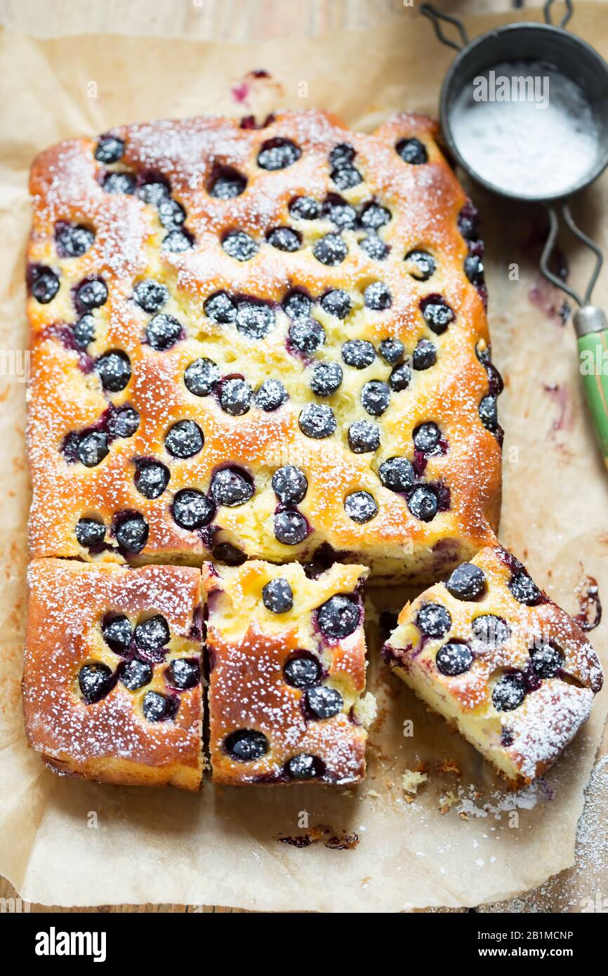 Lime juice, yoghurt, olive oil cake with blueberries Stock Photo