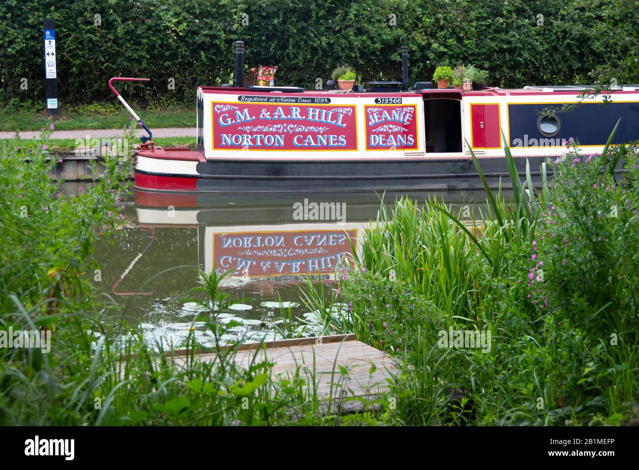 Canal Boat moored beside canal at Foxton Locks on the Leicester line of the Grand Union Canal, Leicestershire, England Stock Photo