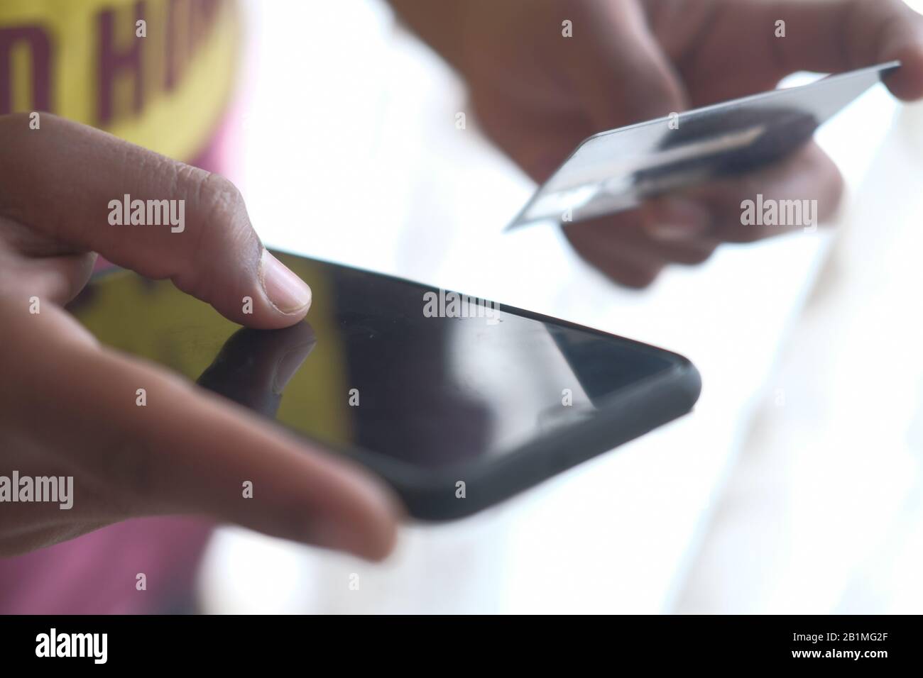 Close up of man hand paying by credit card Stock Photo