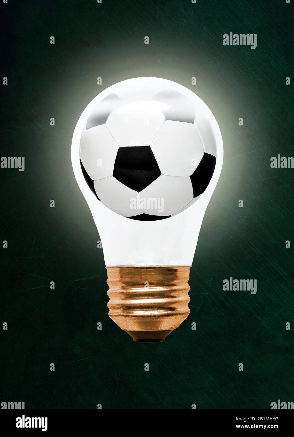 Soccer ball inside glowing light bulb against blackboard with copy