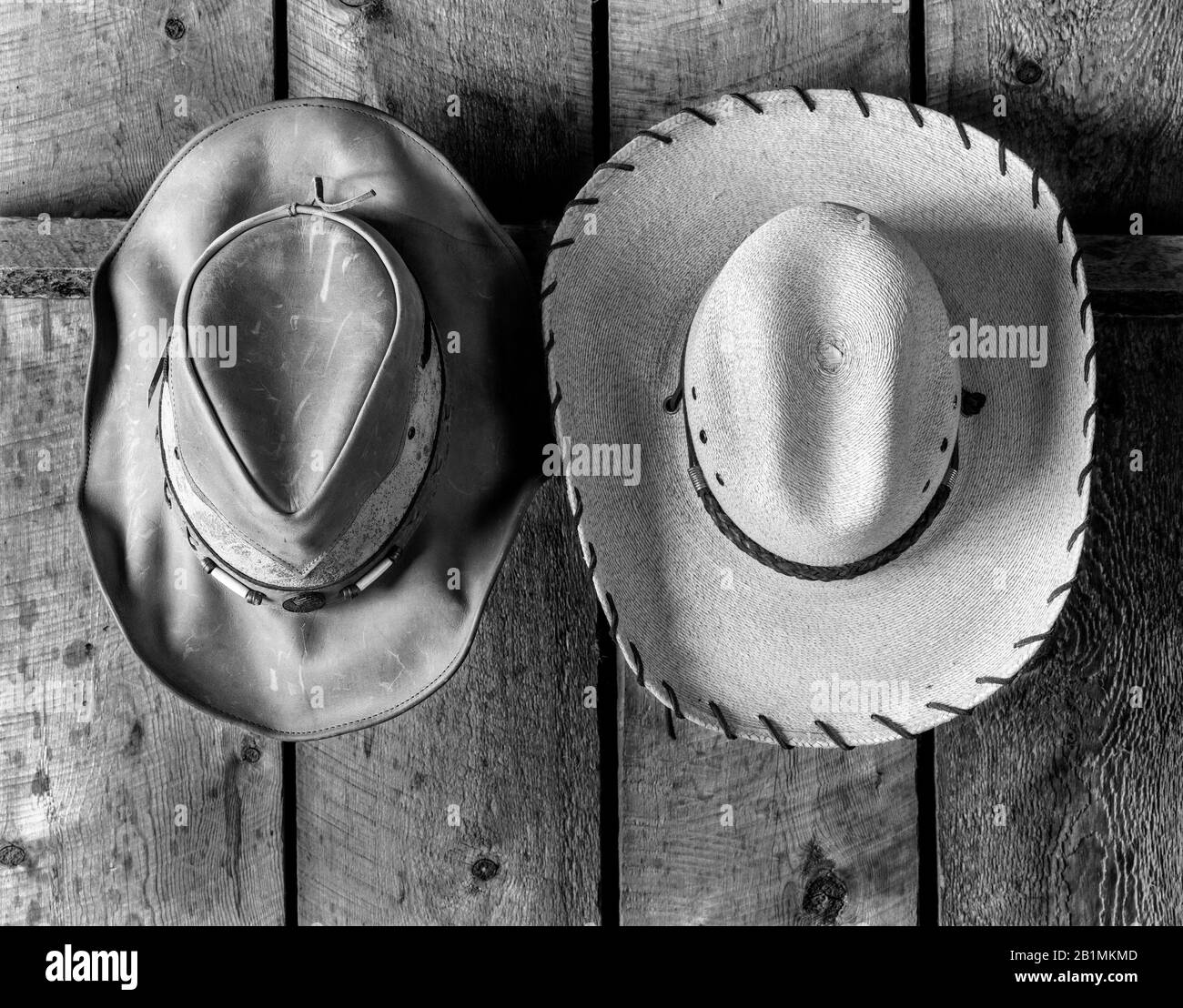 BW02218-01...WYOMING - Three hats at the CM ranch narar Dubois. Ilford FP4+  4x5 Film. Stock Photo