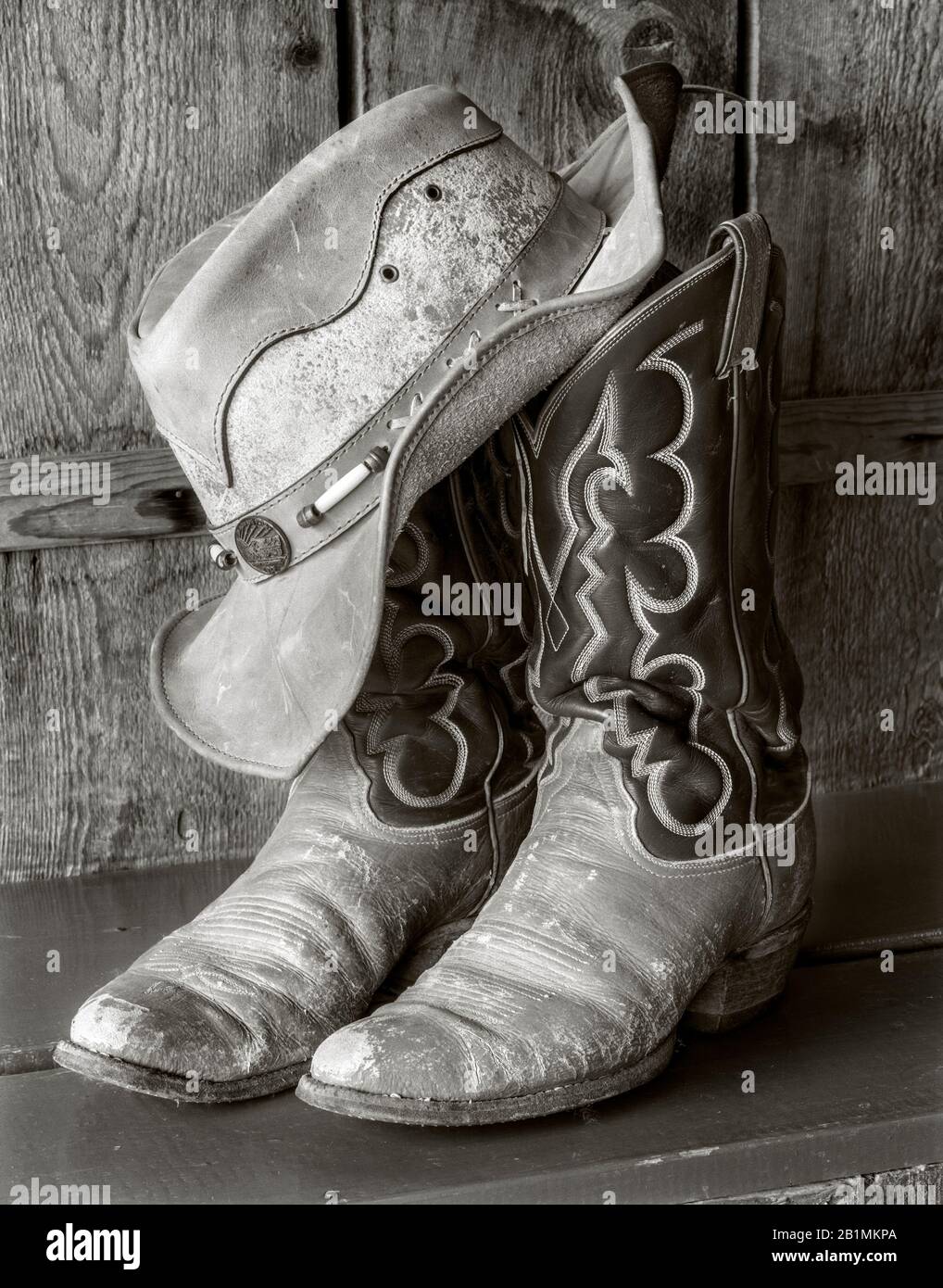 BW02223-00...WYOMING - Hat and boots at the CM Ranch near Dubois. Ilford FP4+  4x5 Film. Stock Photo