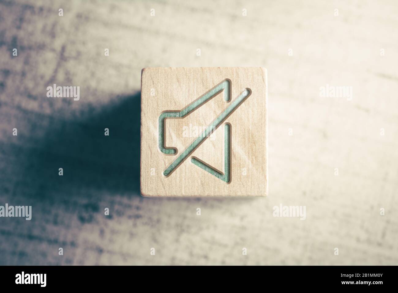 Volume Mute Icon On A Wooden Block On A Table Stock Photo