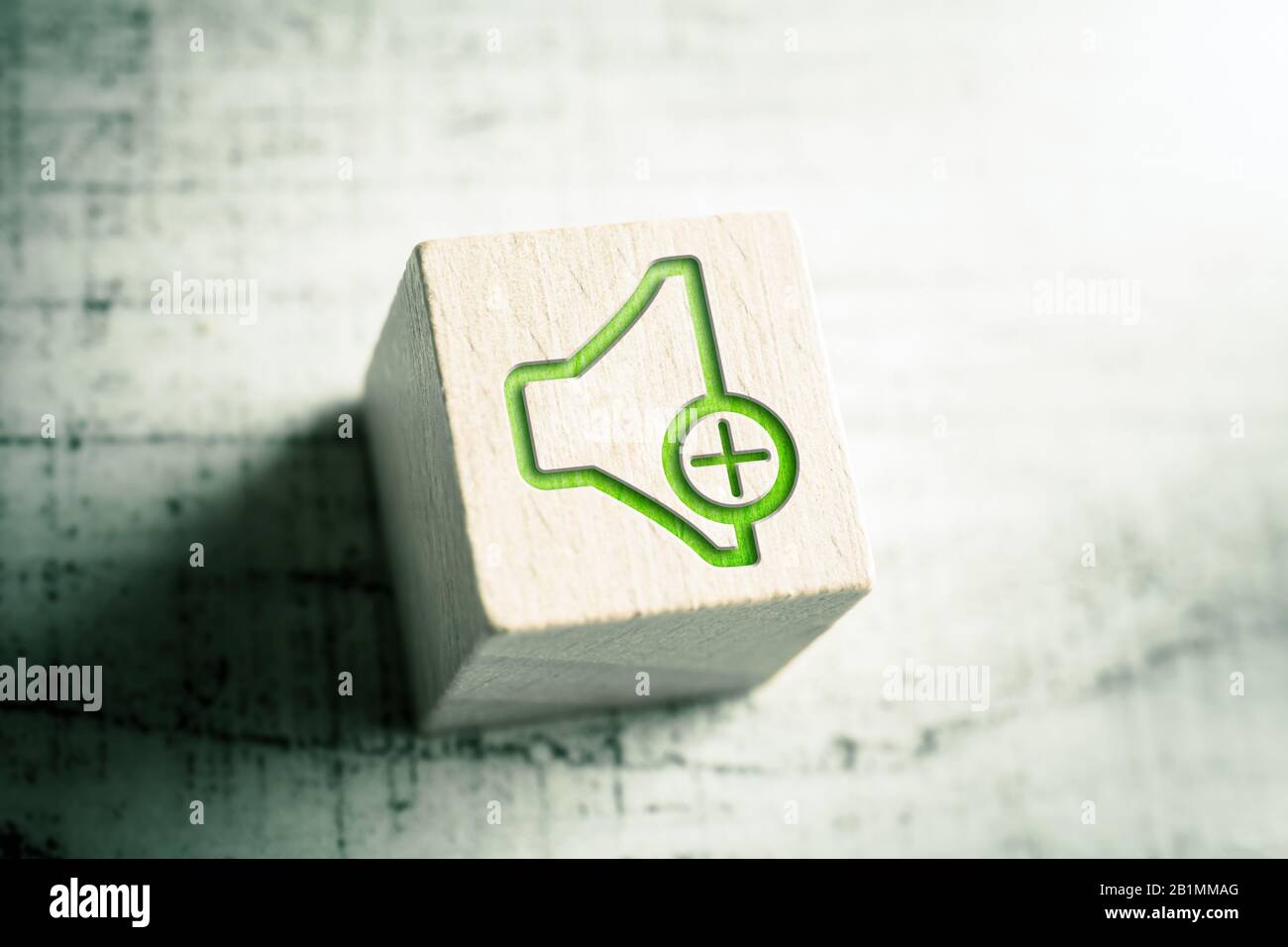 Volume Up Icon On A Wooden Block On A Table Stock Photo