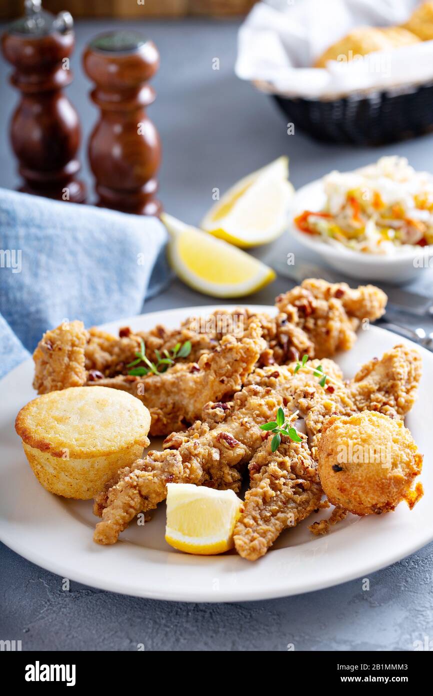 Southern fried fish with cornbread Stock Photo