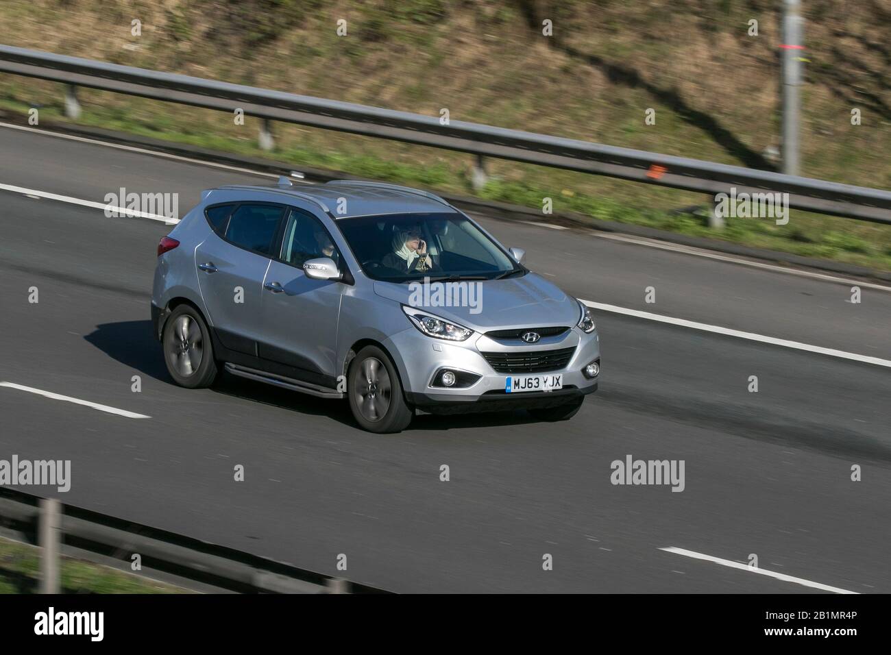 2013 Hyundai Ix35 Premium 4Wd Crdi Silver Car Diesel driving on the M6 motorway near Preston in Lancashire, UK Stock Photo