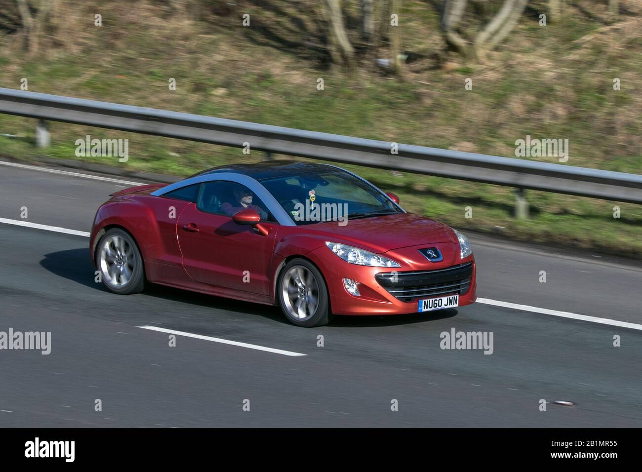 2017 Peugeot Rcz Gt Thp 156 Red car Petrol driving on the M6 motorway near Preston in Lancashire, UK Stock Photo