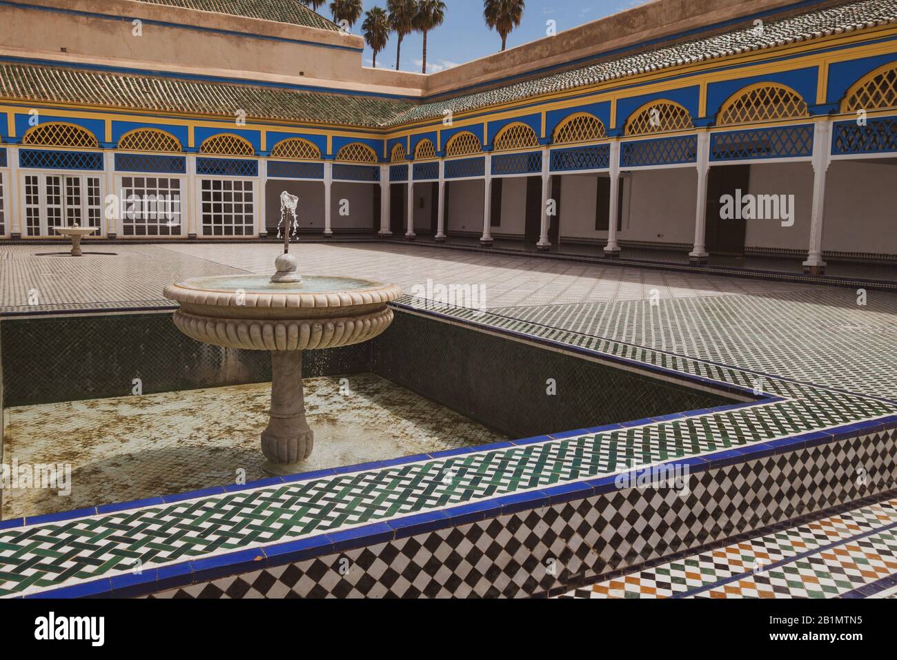 Beautiful courtyard of estate with fountain and mosaic walls in Marrakesh, Morocco. Royalty free stock photo. Stock Photo