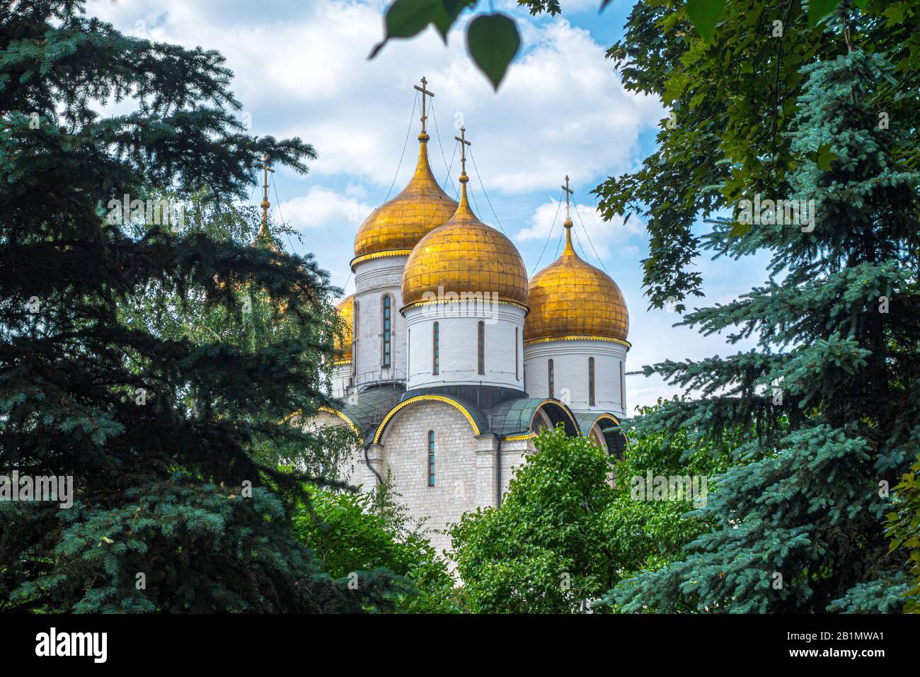Dormition Cathedral inside Kremlin surrounded by trees in summer, Moscow,  Russia. Royalty free stock photo Stock Photo - Alamy