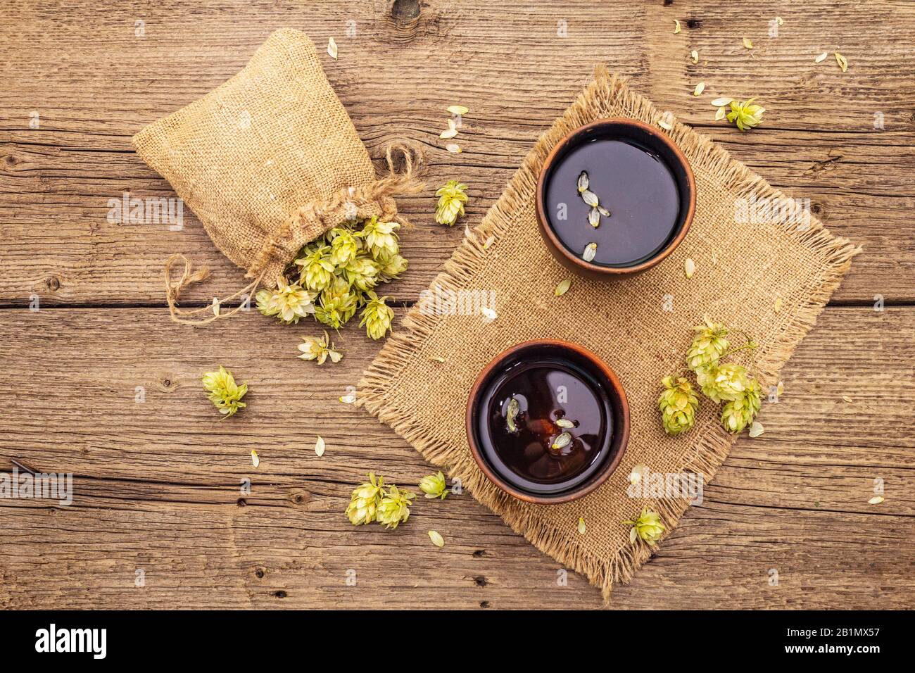 Cup of calming herbal tea with fresh wild hops. Brewery. Beer