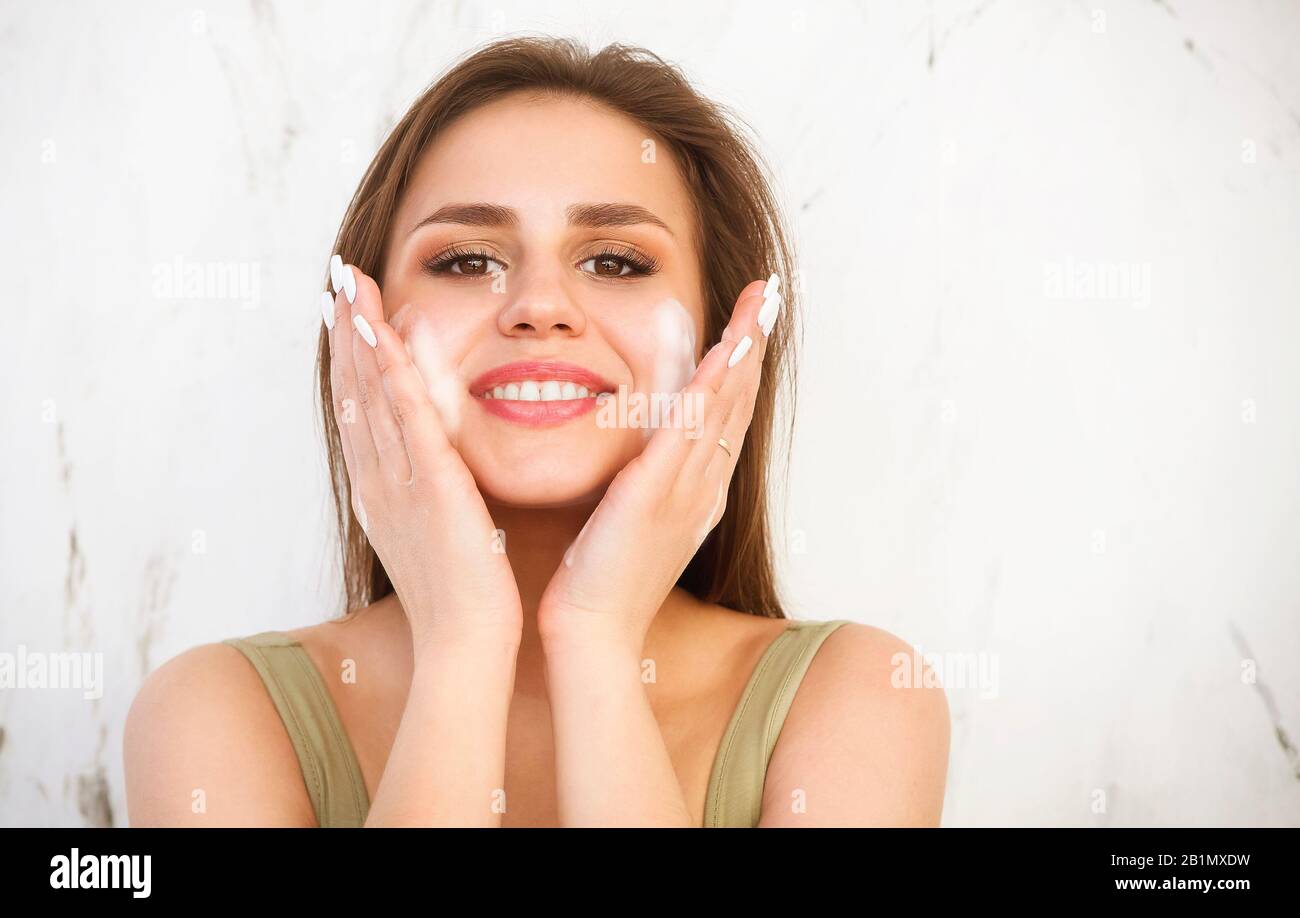 Beautiful woman face wash hi-res stock photography and images - Alamy