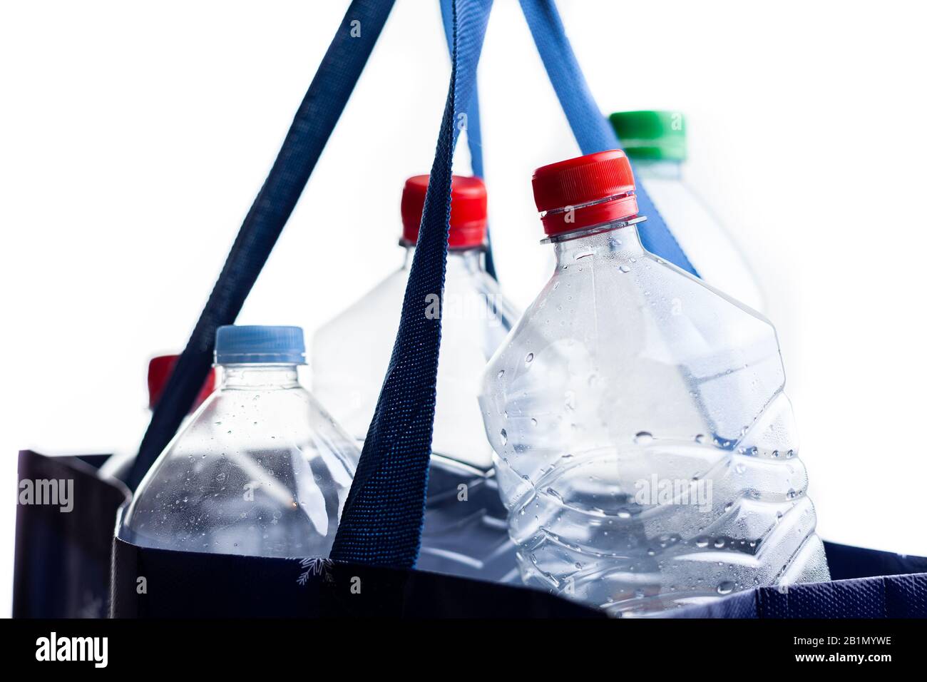 Used plastic bottles in a shopping bag. Ready to recycle. Say no to plastic consumption. Stock Photo
