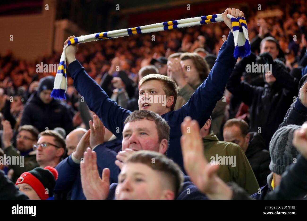 Football supporter holds up scarf hires stock photography and images