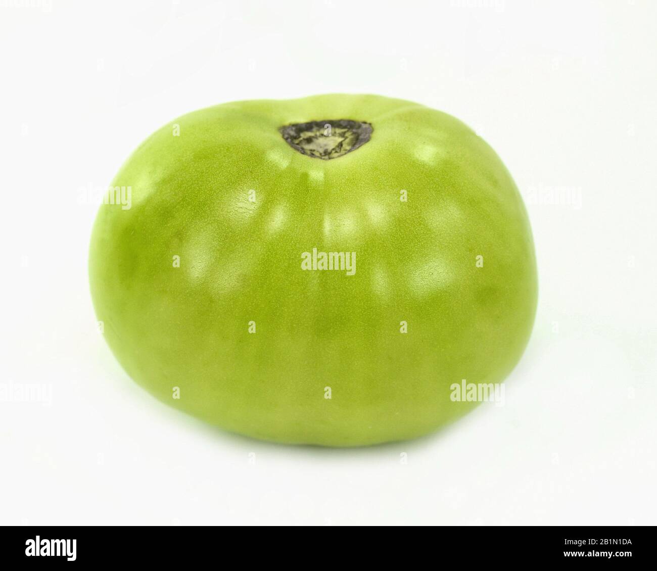green tomato on white background Stock Photo - Alamy