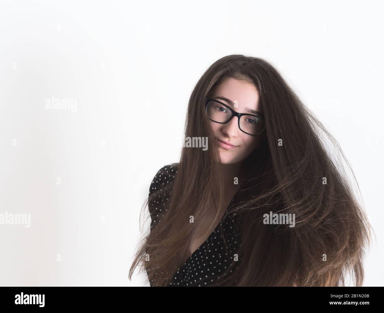 Portrait of a Bespectacled Long-haired Brunette Teen Girl Stock Photo