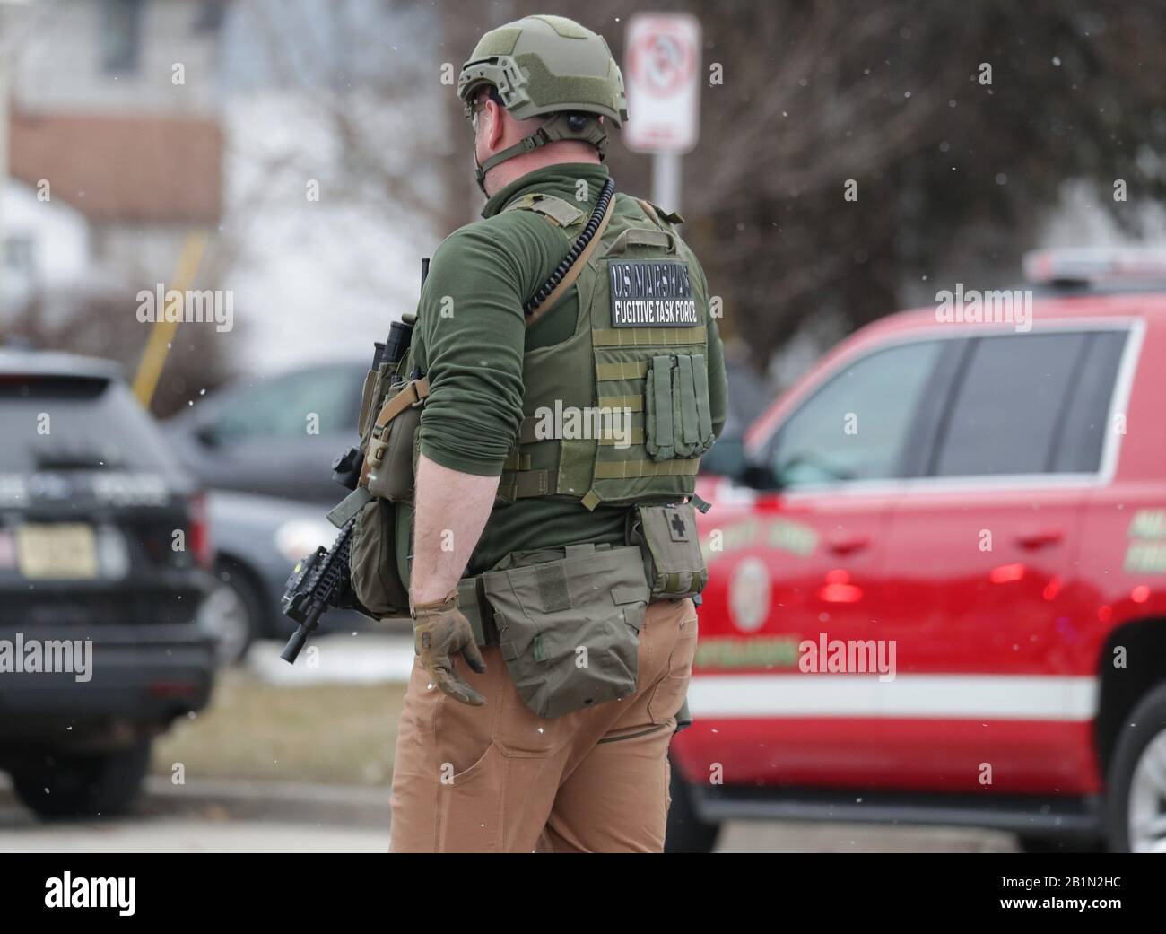 Milwaukee, USA. 26th Feb, 2020. Police and emergency officials work on the scene of an active shooter in Milwaukee, Wisconsin on Feb. 26, 2020 on West State St. and North 35th street near Molson Coors in Milwaukee. Credit: Sipa USA/Alamy Live News Stock Photo