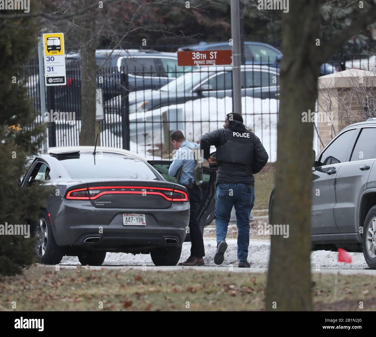 Milwaukee, USA. 26th Feb, 2020. Police gear up on arrival on the Highland Blvd. side of Molson Coors corporate area as police respond to active shooter in Milwaukee, Wisconsin on Feb. 26, 2020. Credit: Sipa USA/Alamy Live News Stock Photo