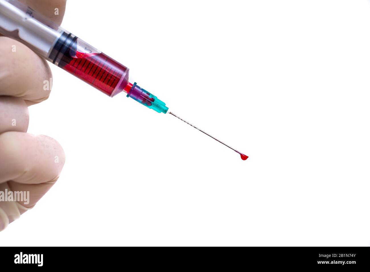 close-up syringe and blood sample inside Stock Photo
