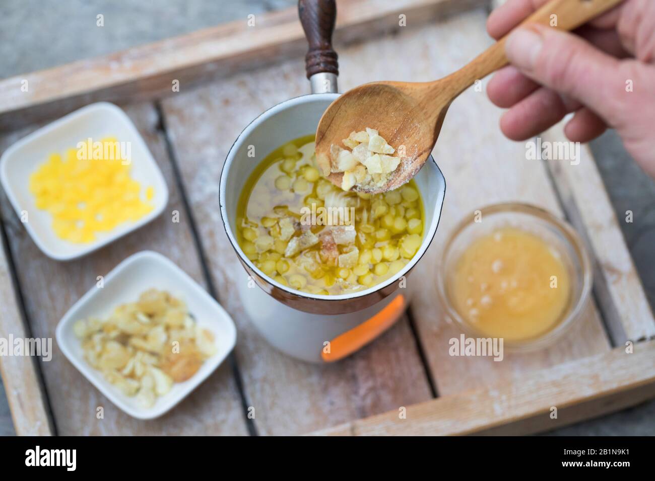 production of a lip creams, made from spruce resin, olive oil, bee wax and honey, Germany Stock Photo