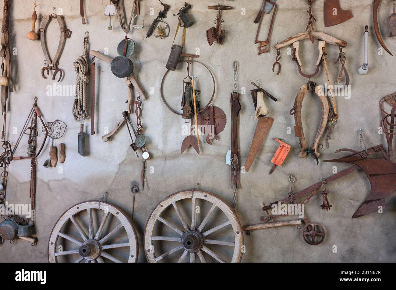 Tools of an old craftsman hanging on the wall of his workshop in Monferrato, province of Alessandria, Italy Stock Photo