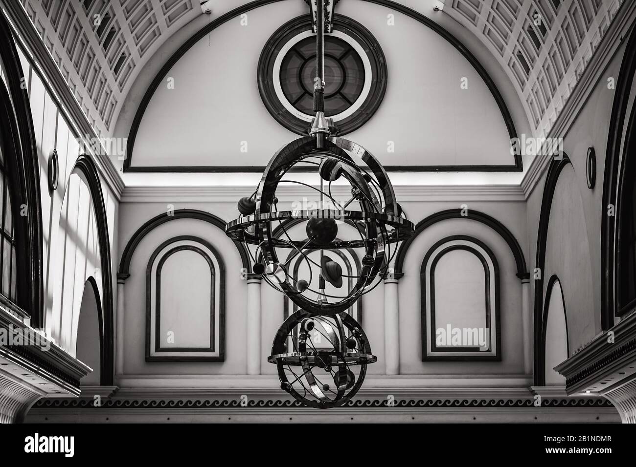 Structure of a solar system hanging from the ceiling of a neoclassical style building Stock Photo