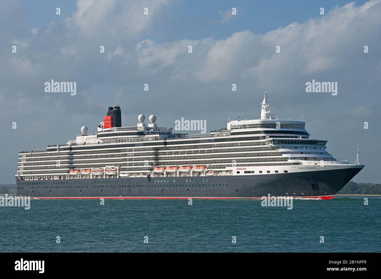 The Cunard cruise liner Queen Elizabeth departing Southampton Water, UK on the 1st July 2013, seen from Calshot. Stock Photo