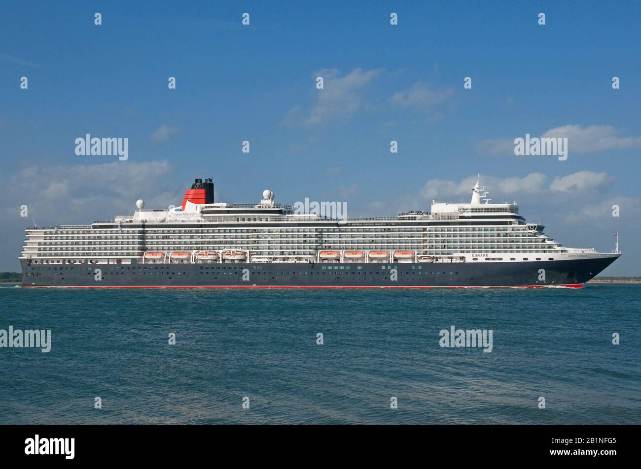 The Cunard cruise liner Queen Elizabeth departing Southampton Water, UK on the 1st July 2013, seen from Calshot. Stock Photo
