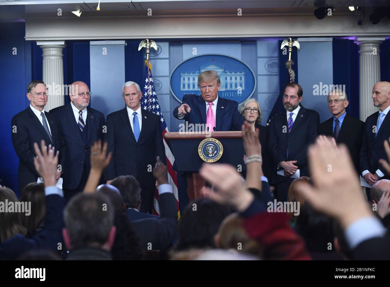 President Donald Trump takes questions on the global coronavirus (COVID19) outbreak in the Brady Press Briefing Room of the White House in Washington, DC on Wednesday, February 26, 2020. Behind him are (L-R) Robert Kadlec, Assistant HHS Secretary for Preparedness and.Response, Robert R. Redfield, Director of the Centers.for Disease Control and Prevention, Vice President Mike Pence, Dr. Anne Schuchat of the CDC, Health and Human Services (HHS) Secretary Alex Azar, Anthony Fauci, Director of the NIH National Institute for Allergy and Infectious Diseases, and Stephen M. Hahn, Commissioner for Foo Stock Photo