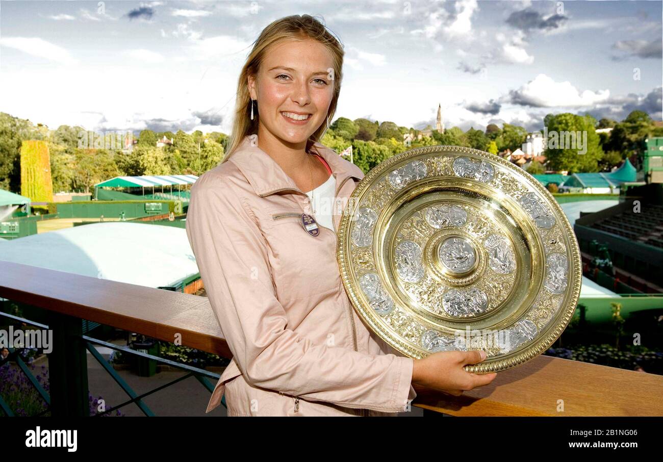 London, UK. 04th July, 2004. WIMBLEDON CHAMPIONSHIPS 03/07/04 DAY 12 MARIA SHARAPOVA (RUS) WITH TROPHY AFTER SHE WINS LADIES FINAL Photo Pool Photo AELTC/ International Sports Fotos Credit: Roger Parker/Alamy Live News Stock Photo