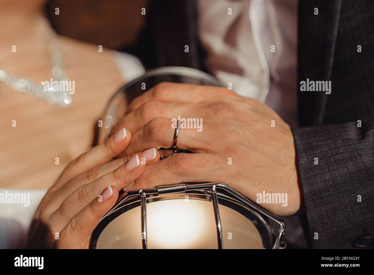 hand on the hand of the bride and groom, engagement smooth simple white ...
