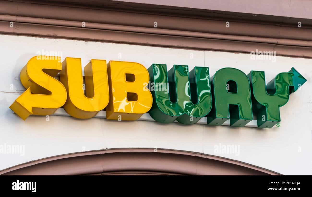 TRIER, GERMANY - SEPTEMBER 13, 2019: Subway Logo And Sign Or Signboard On Facade. Subway Is American Fast Food Restaurant Chain That Specializes In Sa Stock Photo
