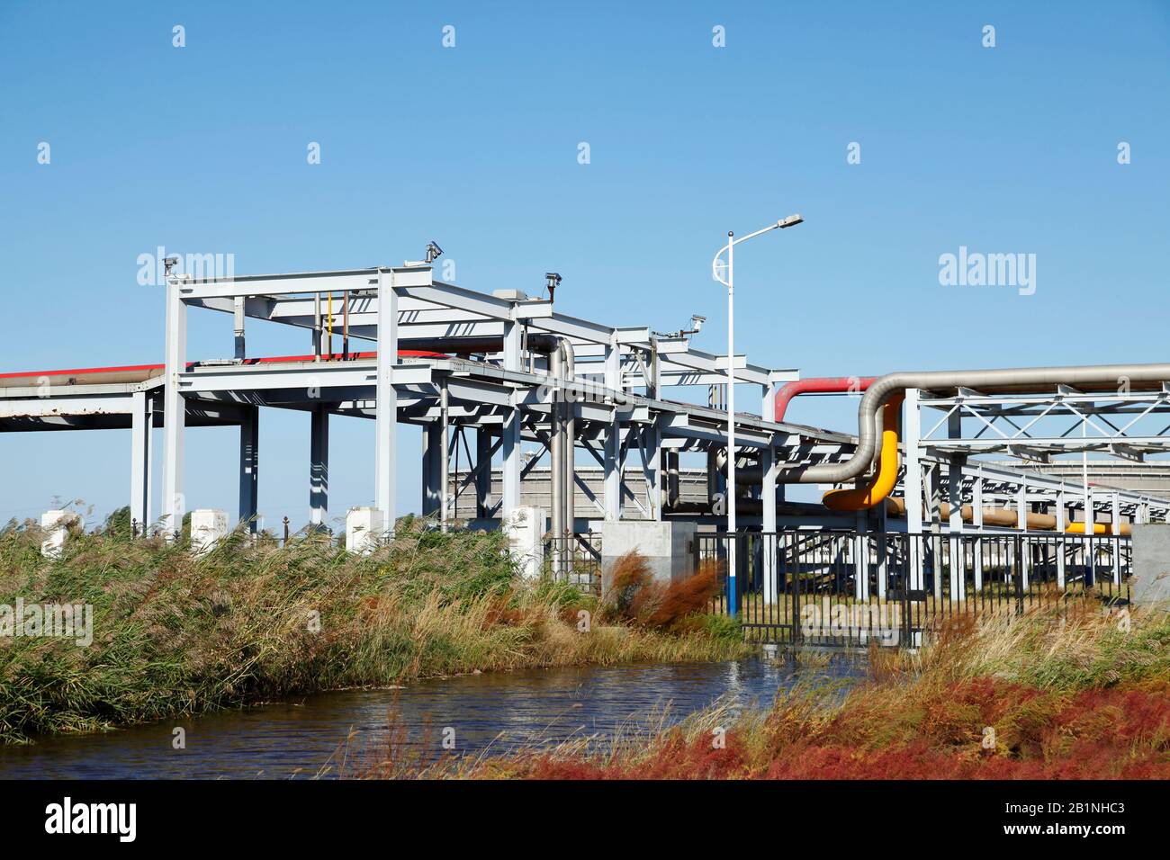 Oil field scene, oil pipelines and facilities Stock Photo Alamy