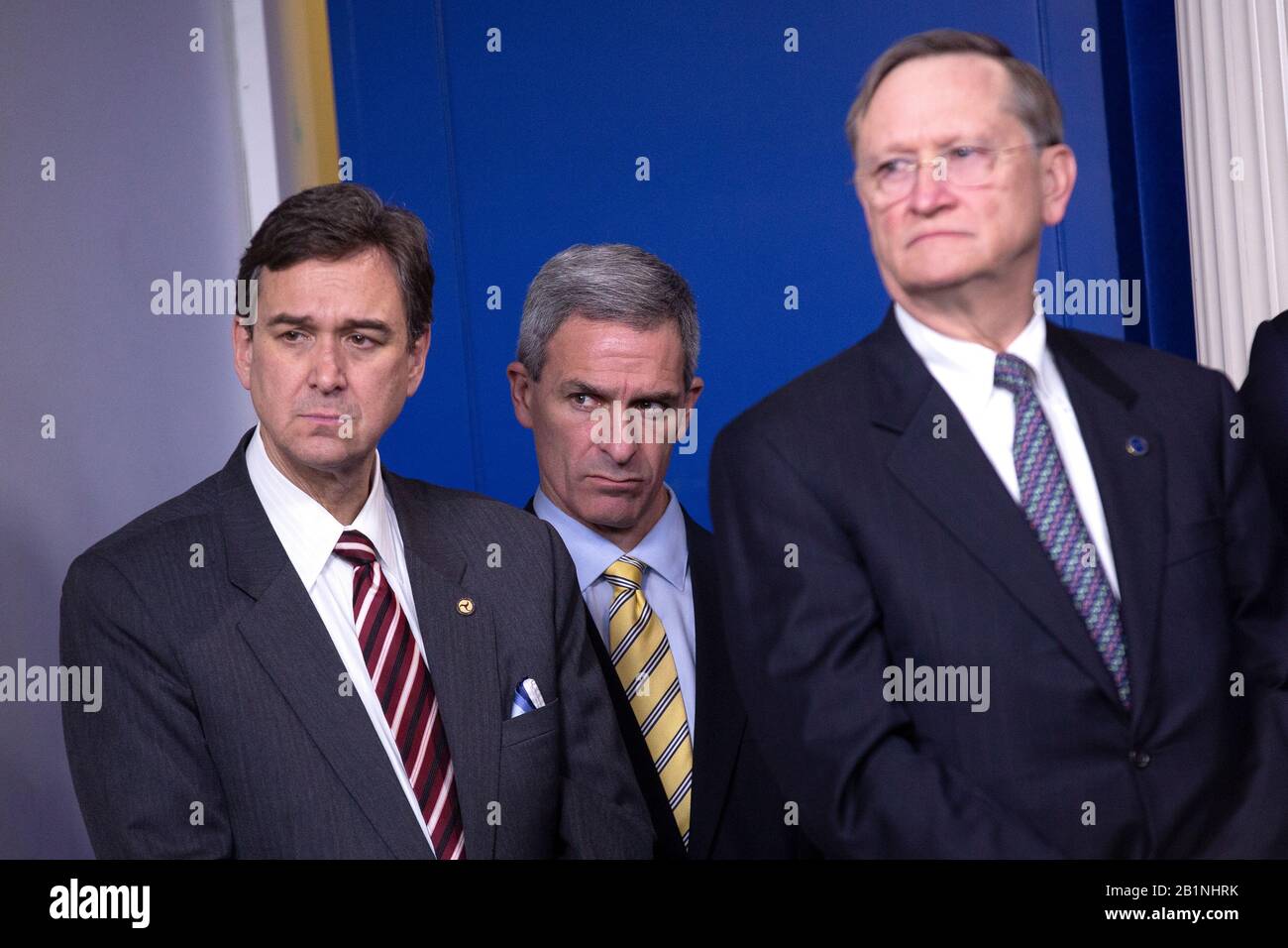 Acting Director of the United States Citizenship and Immigration Services Ken Cuccinelli, center, listens as United States President Donald J. Trump delivers remarks during a news conference in the James S. Brady Briefing Room of the White House in Washington, DC, U.S., on Wednesday, February 26, 2020. Trump, joined by members of the Coronavirus Task Force, attempted to lessen concerns over the Coronavirus after health officials told lawmakers that it is seemingly inevitable that the disease will spread in the United States. Credit: Stefani Reynolds/CNP /MediaPunch Stock Photo