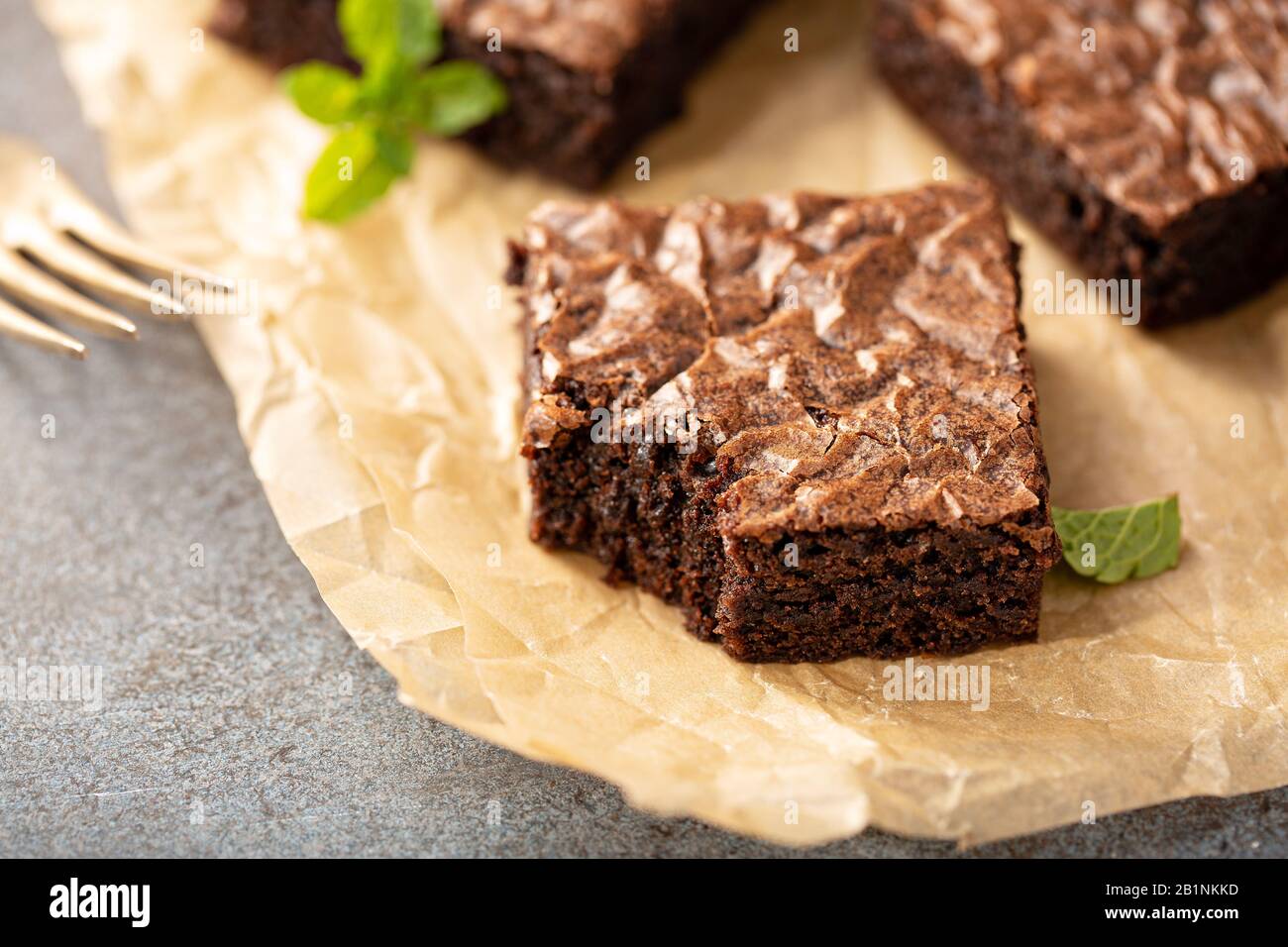 Freshly baked brownies on a parchment paper Stock Photo Alamy