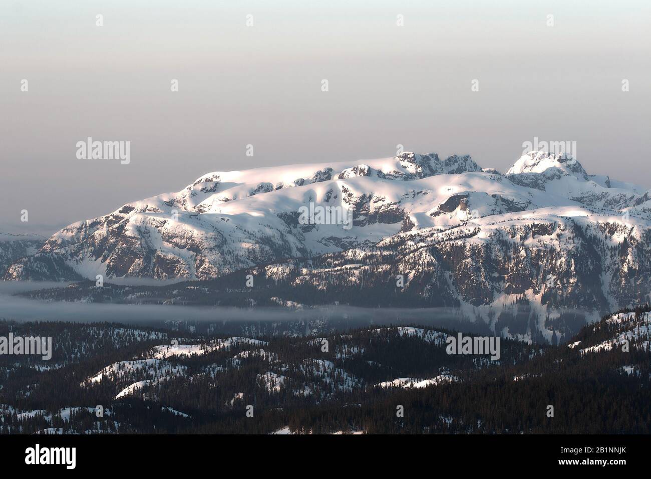 Beautiful Comox Glacier on Vancouver Island as seen from Mount Washington at sunrise. It lies within Strathcona Provincial Park in British Columbia. Stock Photo