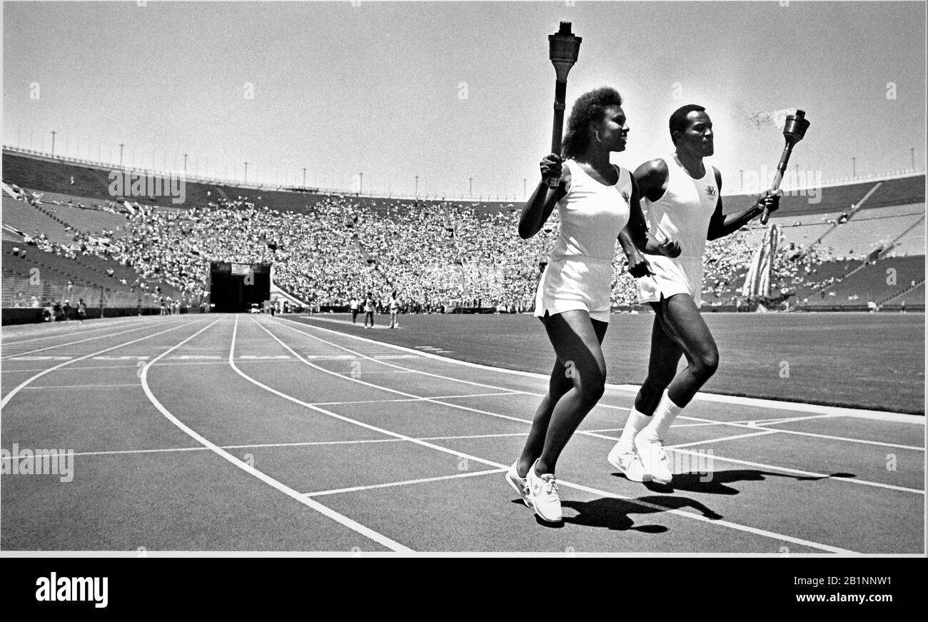 final lap at the 1984 Olympic torch run across the USA in the Coliseum in Los Angeles with the final carriers to the lighting Stock Photo