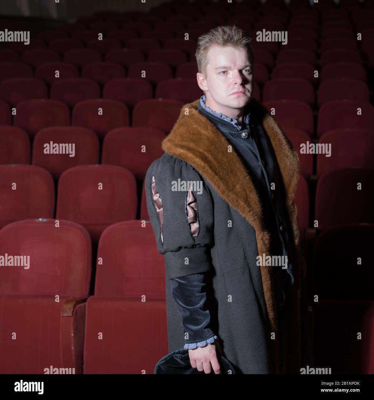 Actor dressed historical costume in interior of old theater Stock Photo ...