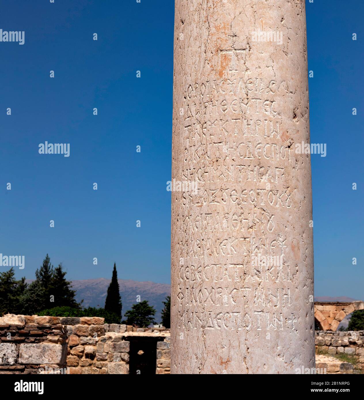 Marble column with Greek inscription from the ancient city Anjar, Lebanon.  Capital of Umayyad dynasty, first Arab empire. UNESCO World Heritage Site. Stock Photo