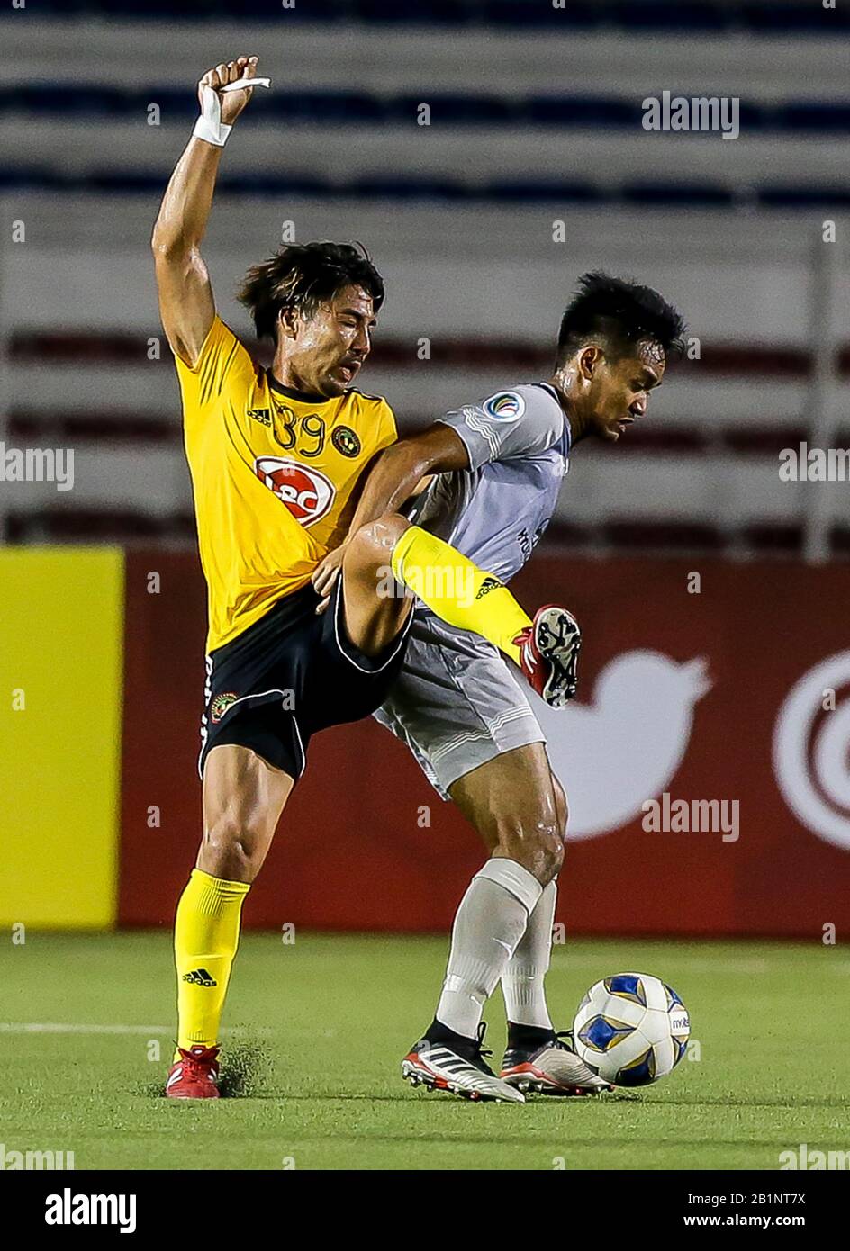 Manila. 26th Feb, 2020. Takumi Uesato (L) of the Philippines' Kaya FC-Iloilo competes with a player of Singapore's Tampines Rovers FC during their group H match at the AFC Cup 2020 in Manila, the Philippines on Feb. 26, 2020. Credit: Rouelle Umali/Xinhua/Alamy Live News Stock Photo
