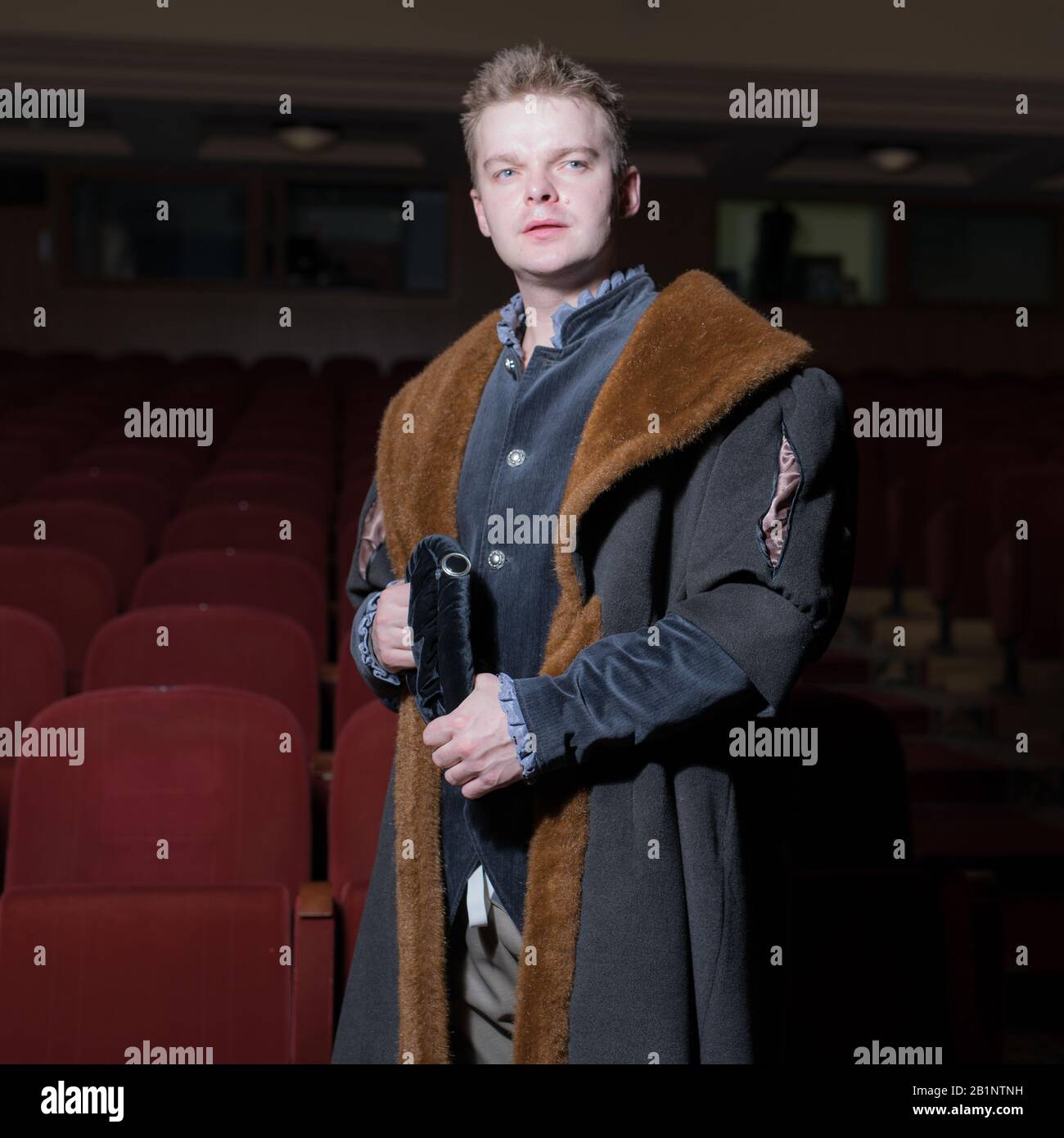 Actor dressed historical costume in interior of old theater Stock Photo ...