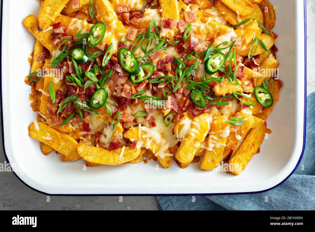 Cheese fries with bacon and green onions Stock Photo Alamy