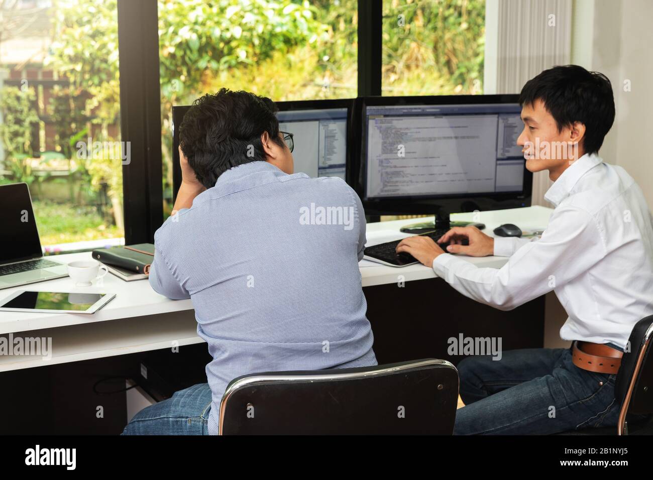 Programmers team working in a software developing. Developing programming and coding technologies. Website design. Cyber space concept. Stock Photo