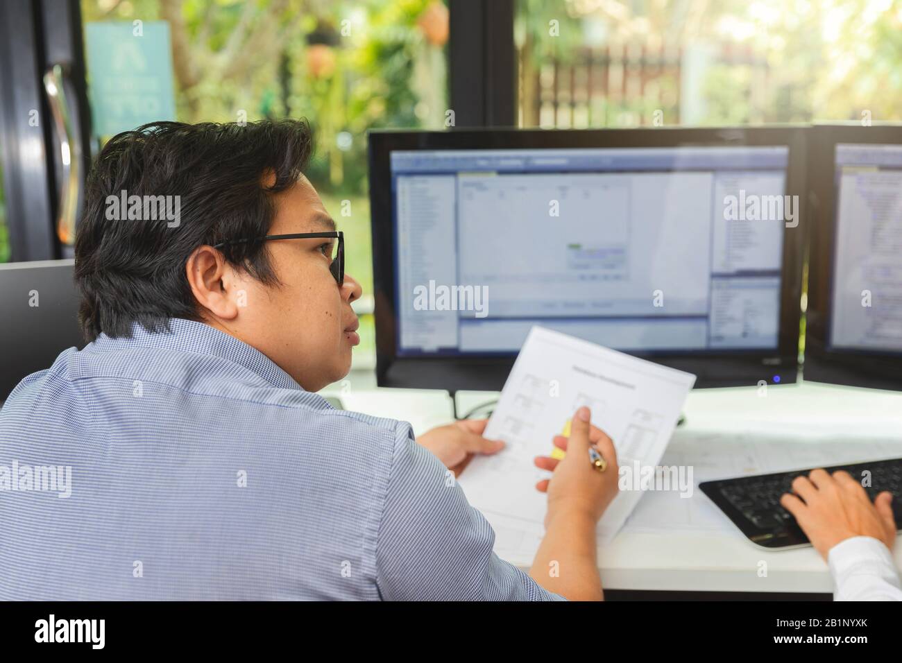 Programmer working in a software developing. Developing programming and coding technologies. Website design. Cyber space concept. Stock Photo