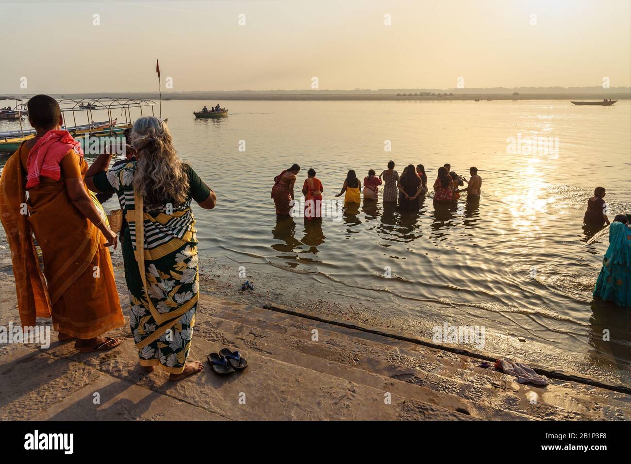 People bathing in water holy Ganga river in morning. Varanasi. India Stock Photo