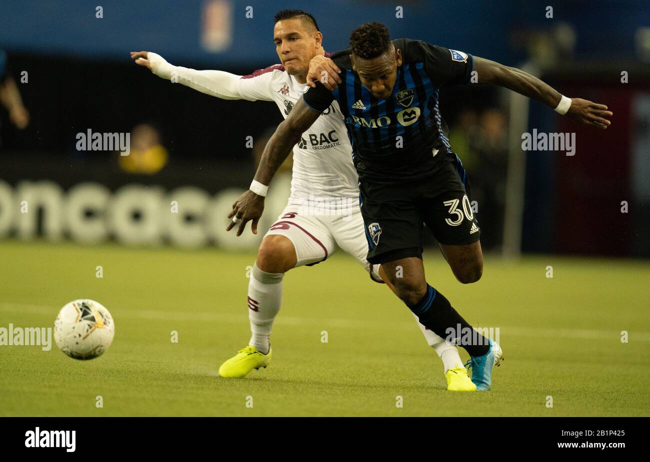 Montreal, Quebec, Canada. 26th Feb, 2020. Montreal Impact #30 Romell Quioto and Deportivo Saprissa #8 David Guzmán during the first half in a CONCACAF Champions League soccer match. Credit: Patrice Lapointe/ZUMA Wire/Alamy Live News Stock Photo
