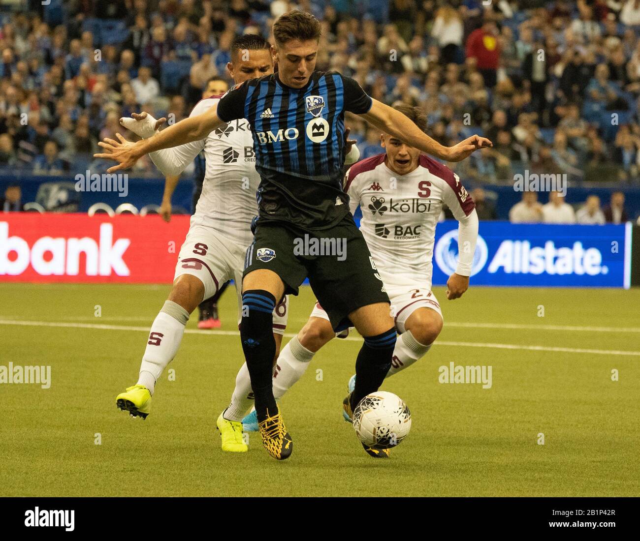 Montreal, Quebec, Canada. 26th Feb, 2020. Montreal Impact #5 Luis Binks Deportivo Saprissa #8 David Guzmán and # #27 Manfred Ugalde during the first half in a CONCACAF Champions League soccer match. Credit: Patrice Lapointe/ZUMA Wire/Alamy Live News Stock Photo