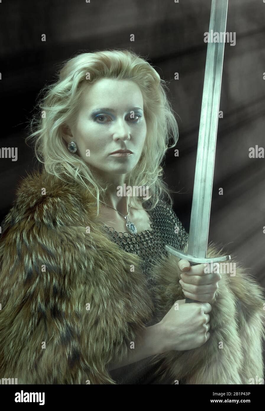 Valkyrie.Viking girl with sword Stock Photo