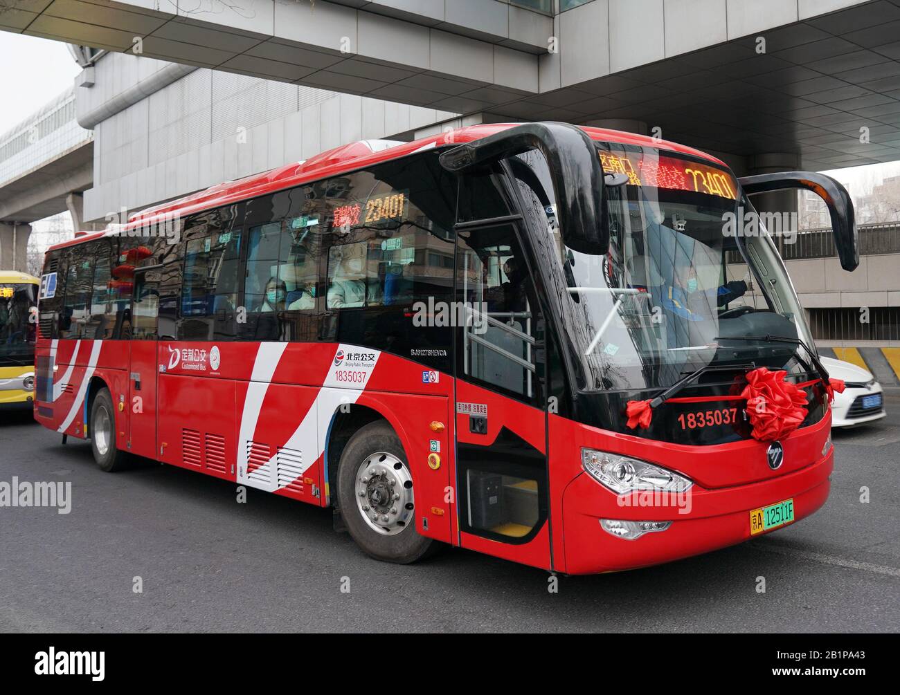 Beijing, China. 27th Feb, 2020. A customized bus runs in Beijing, capital of China, Feb. 27, 2020. Beijing launched 164 customized bus lines that run on online reservations on Thursday. Individuals and companies can make reservations or buy tickets through a micro-app on the popular social media platform WeChat, according to Beijing Public Transport Corp. Credit: Zhang Chenlin/Xinhua/Alamy Live News Stock Photo