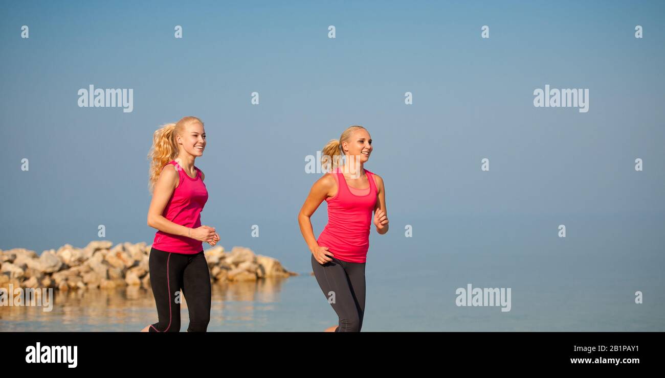 Two Women Running On The Beach Early Morning Summer Workout Stock 